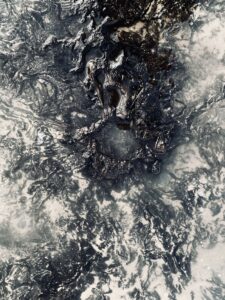 A monochrome picture of a frozen lake.