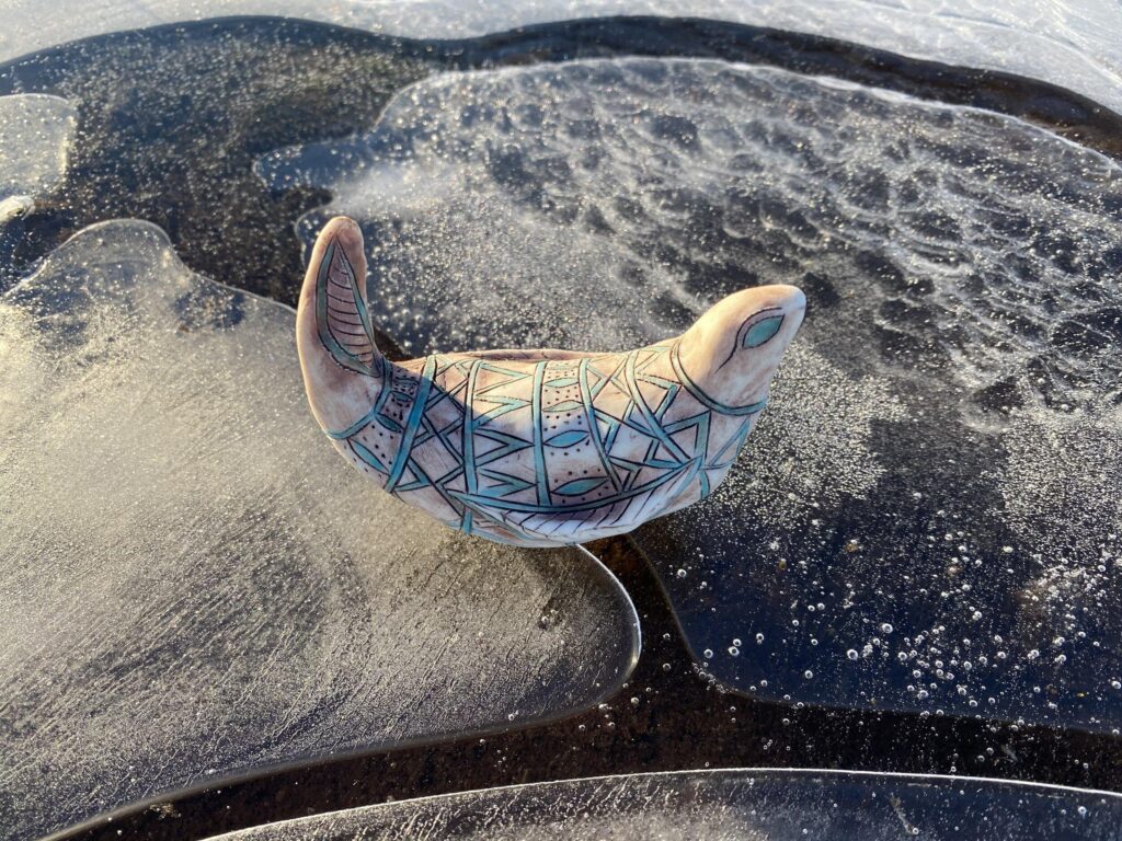 An ice sculpture with a bird on it.