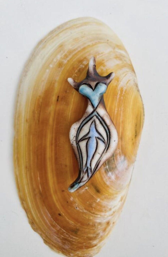 A shell with an image of a woman on it.