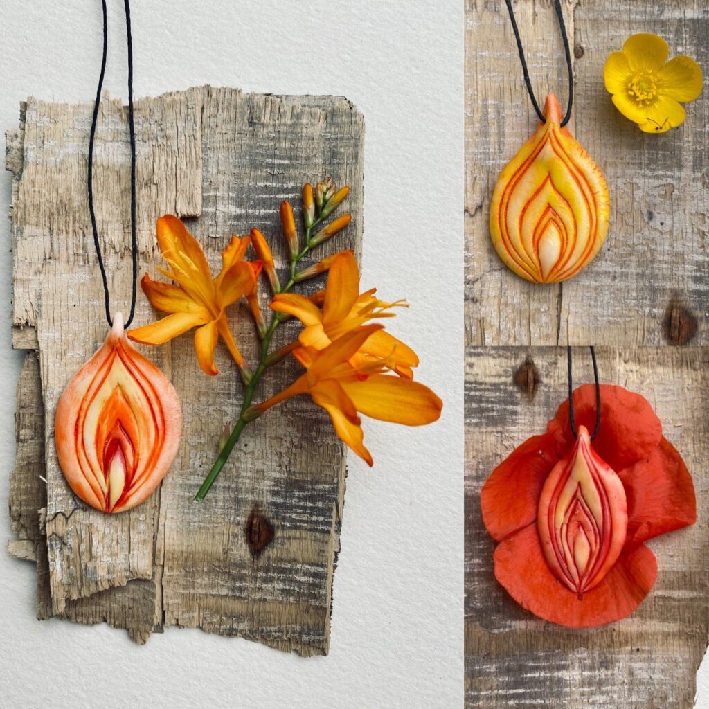 Three necklaces with flowers and leaves on them.