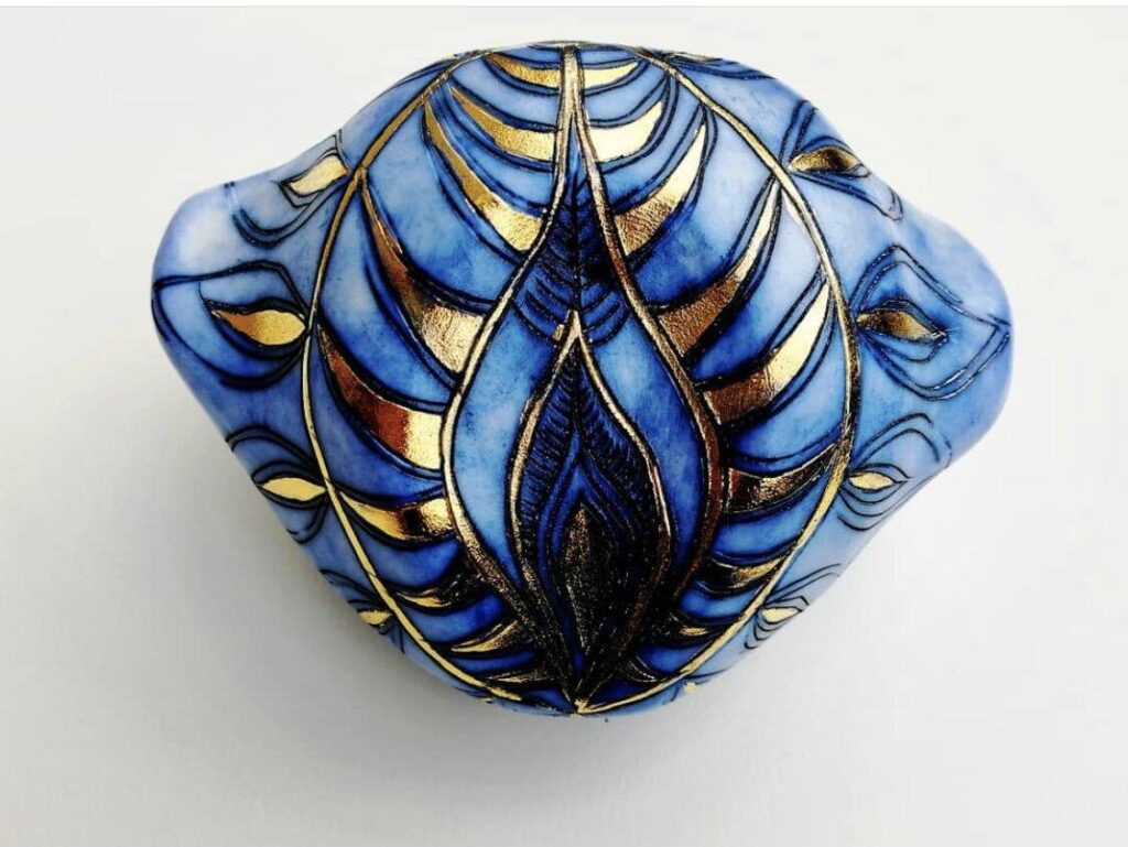 A blue and gold design on a white surface.